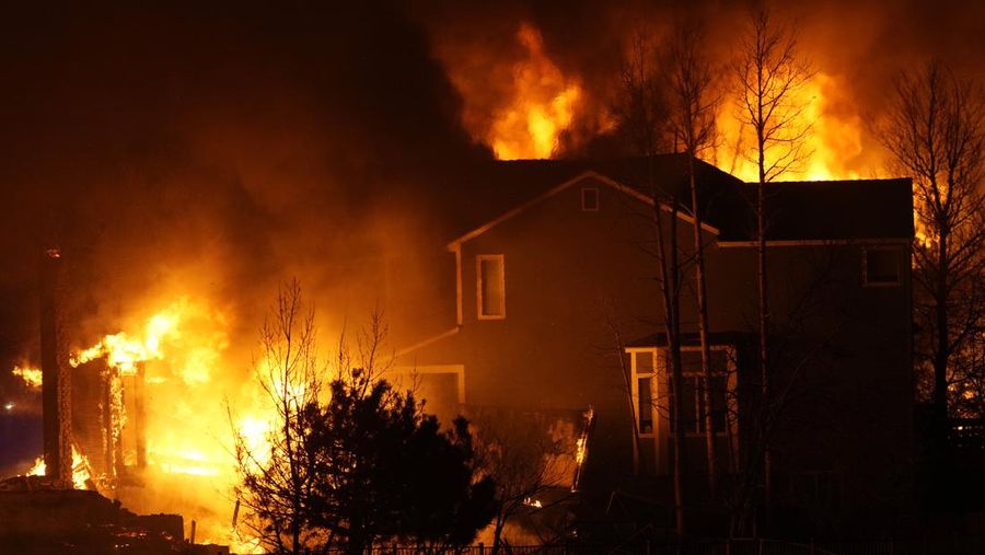 Structures burn, including an Element Hotel, as a wind-driven wildfire forced evacuation of the Superior suburb of Boulder, Colorado, U.S. December 30, 2021.  Trevor Hughes/USA TODAY NETWORK via REUTERS
NO RESALES. NO ARCHIVES MANDATORY CREDIT
     TPX IMAGES OF THE DAY