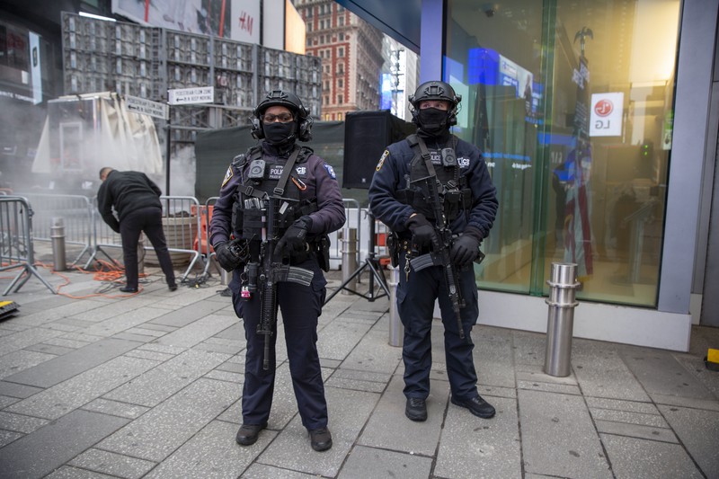 New Years Eve Times Square NYPD Chief of Counterterrorism Martine Materasso walks in Times Square in New York City on Thursday, Dec. 30, 2021. Officers from the Counterterrorism Bureau and other NYPD units will patrol during the New Year's Eve bash on Friday. The city is permitting a smaller crowd than before the pandemic and revelers must wear face masks and prove they have been vaccinated. (AP Photo/Ted Shaffrey)