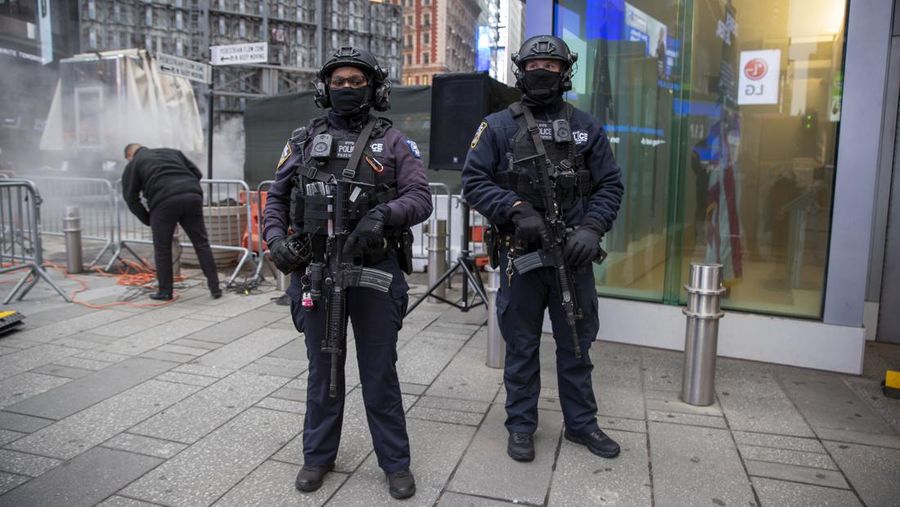 NYPD Chief of Counterterrorism Martine Materasso walks in Times Square in New York City on Thursday, Dec. 30, 2021. Officers from the Counterterrorism Bureau and other NYPD units will patrol during the New Year's Eve bash on Friday. The city is permitting a smaller crowd than before the pandemic and revelers must wear face masks and prove they have been vaccinated. (AP Photo/Ted Shaffrey)