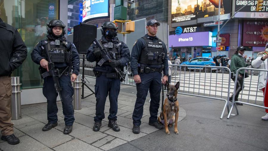 NYPD Chief of Counterterrorism Martine Materasso walks in Times Square in New York City on Thursday, Dec. 30, 2021. Officers from the Counterterrorism Bureau and other NYPD units will patrol during the New Year's Eve bash on Friday. The city is permitting a smaller crowd than before the pandemic and revelers must wear face masks and prove they have been vaccinated. (AP Photo/Ted Shaffrey)