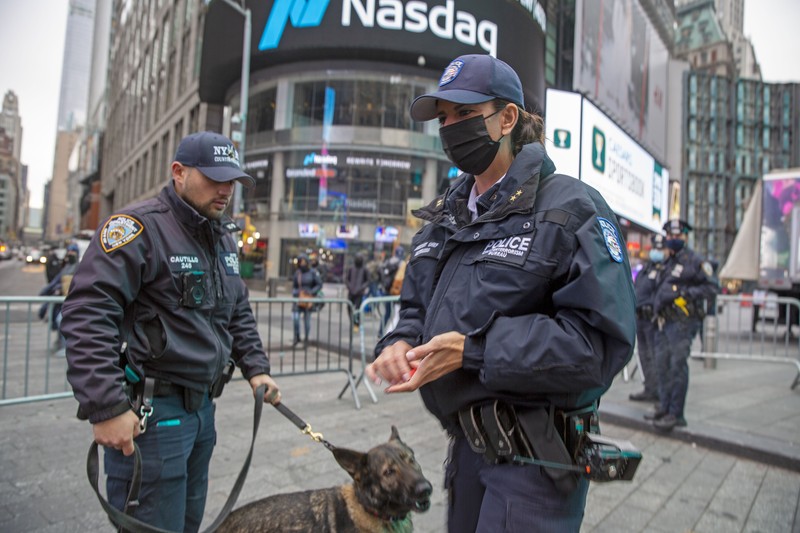 NYPD Chief of Counterterrorism Martine Materasso walks in Times Square in New York City on Thursday, Dec. 30, 2021. Officers from the Counterterrorism Bureau and other NYPD units will patrol during the New Year's Eve bash on Friday. The city is permitting a smaller crowd than before the pandemic and revelers must wear face masks and prove they have been vaccinated. (AP Photo/Ted Shaffrey)