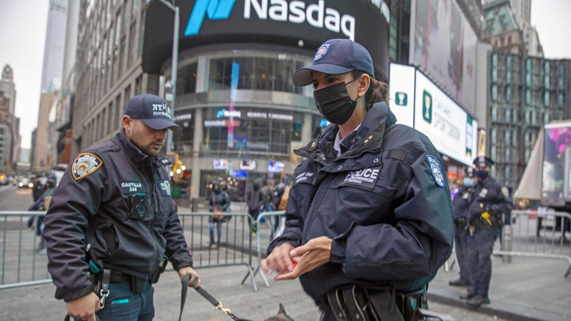 NYPD Chief of Counterterrorism Martine Materasso walks in Times Square in New York City on Thursday, Dec. 30, 2021. Officers from the Counterterrorism Bureau and other NYPD units will patrol during the New Year's Eve bash on Friday. The city is permitting a smaller crowd than before the pandemic and revelers must wear face masks and prove they have been vaccinated. (AP Photo/Ted Shaffrey)