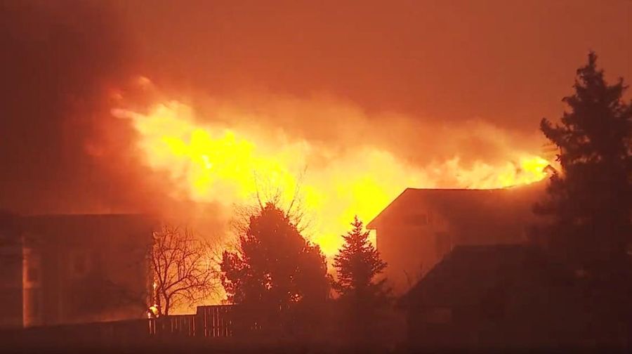 A house burns as a wind-driven wildfire forced evacuation of the Superior suburb of Boulder, Colorado, U.S. December 30,2021 in this still image obtained from a social media video. Eric English/via REUTERS THIS IMAGE HAS BEEN SUPPLIED BY A THIRD PARTY. MANDATORY CREDIT. NO RESALES. NO ARCHIVES.