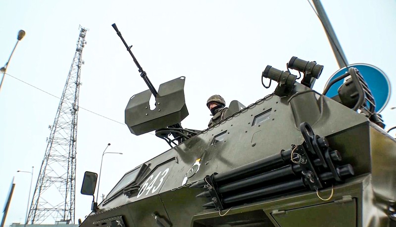 Russia Kazakhstan Protests In this image taken from footage provided by the RU-RTR Russian television, Military vehicles of Russian peacekeepers parked waiting to be uploaded on Russian military planes at an airfield in Russia, Friday, Jan. 7, 2022. Over 70 cargo planes are being deployed in Russia's peacekeeping mission in Kazakhstan according to the Defense Ministry chief spokesman's briefing on Friday, after the worst street protests since the country gained independence three decades ago. The demonstrations began over a near-doubling of prices for a type of vehicle fuel and quickly spread across the country, reflecting wider discontent over the rule of the same party since independence. (RU-RTR Russian Television via AP)