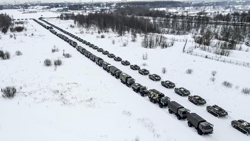 In this image taken from footage provided by the RU-RTR Russian television, Military vehicles of Russian peacekeepers parked waiting to be uploaded on Russian military planes at an airfield in Russia, Friday, Jan. 7, 2022. Over 70 cargo planes are being deployed in Russia's peacekeeping mission in Kazakhstan according to the Defense Ministry chief spokesman's briefing on Friday, after the worst street protests since the country gained independence three decades ago. The demonstrations began over a near-doubling of prices for a type of vehicle fuel and quickly spread across the country, reflecting wider discontent over the rule of the same party since independence. (RU-RTR Russian Television via AP)