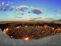The crater fire named "Gates of Hell" is seen near Darvaza, Turkmenistan, Saturday, July 11, 2020. The president of Turkmenistan is calling for an end to one of the country's most notable but infernal sights — the blazing desert natural gas crater
