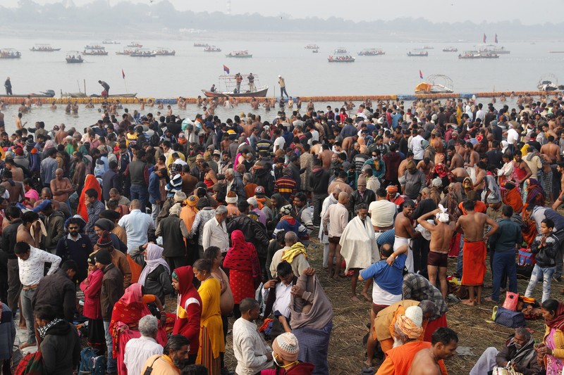 India Virus Outbreak Hindu Festival Hindu devotees crowd the Sangam, the confluence of three rivers — the Ganges, the Yamuna and the mythical Saraswati, to take a ritualistic bath during Makar Sankranti festival that falls during the annual traditional fair of Magh Mela festival, one of the most sacred pilgrimages in Hinduism, in Prayagraj, India. Friday, Jan. 14, 2022. Tens of thousands of devout Hindus, led by heads of monasteries and ash-smeared ascetics, took a holy dip into the frigid waters on Friday despite rising COVID-19 infections in the country. (AP Photo/Rajesh Kumar Singh)
