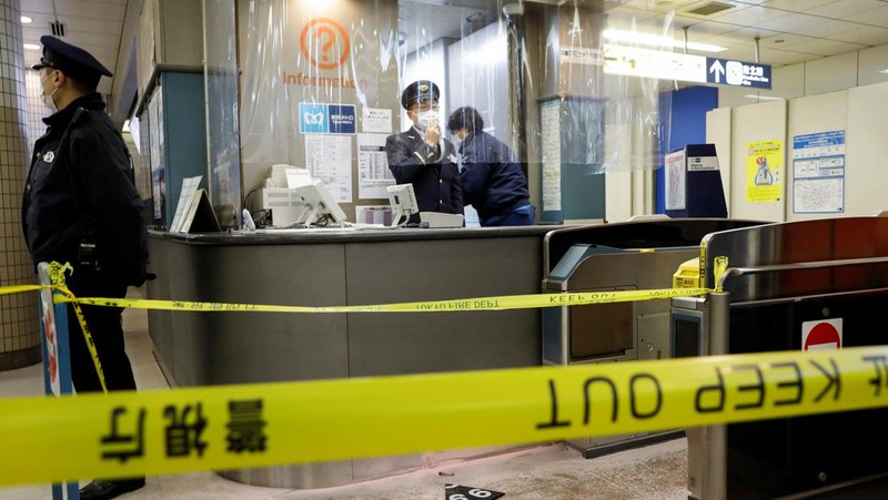 Police officers inspect at the site where a stabbing incident happened at an entrance gate of Tokyo University in Tokyo, Japan January 15, 2022. REUTERS/Issei Kato