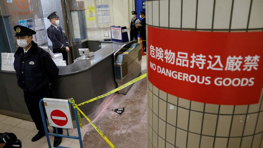 Police officers inspect at the site where a stabbing incident happened at an entrance gate of Tokyo University in Tokyo, Japan January 15, 2022. REUTERS/Issei Kato