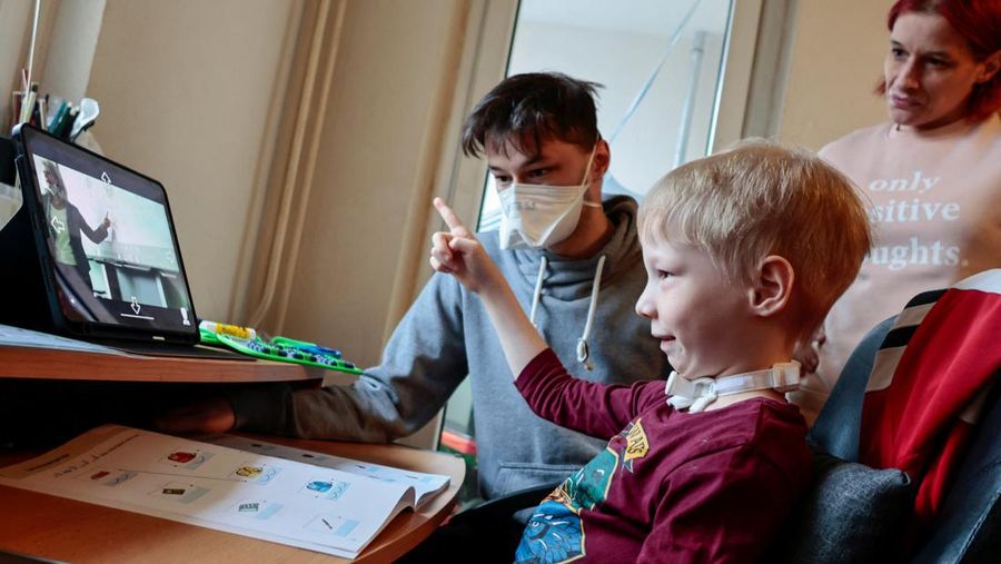A seven-year-old schoolboy Joshua attends his school lesson via a robot avatar, placed in his classroom, in Berlin, Germany January 13, 2022. Picture taken January 13, 2022. REUTERS/Hannibal Hanschke