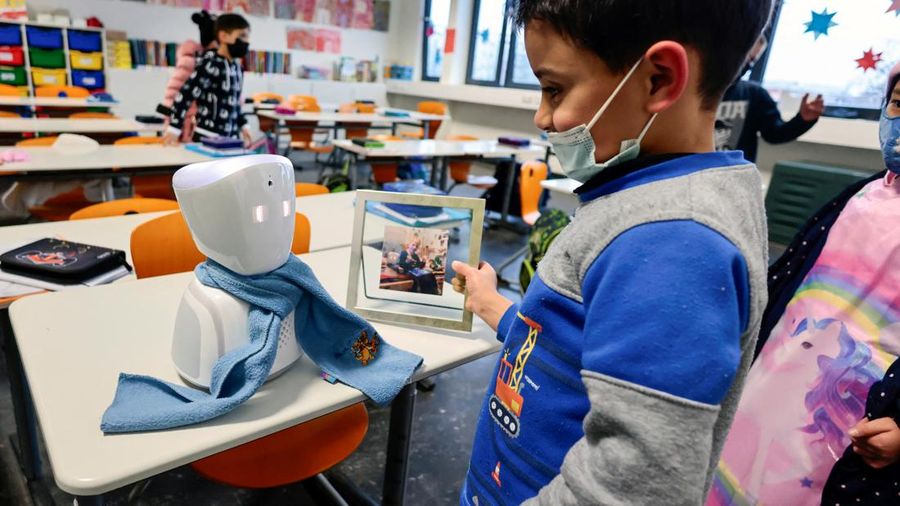 A seven-year-old schoolboy Joshua attends his school lesson via a robot avatar, placed in his classroom, in Berlin, Germany January 13, 2022. Picture taken January 13, 2022. REUTERS/Hannibal Hanschke