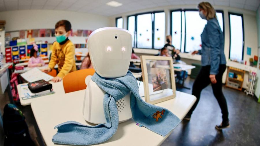 A seven-year-old schoolboy Joshua attends his school lesson via a robot avatar, placed in his classroom, in Berlin, Germany January 13, 2022. Picture taken January 13, 2022. REUTERS/Hannibal Hanschke