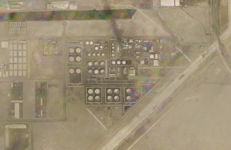 Emirates Persian Gulf Tensions In this satellite image provided by Planet Labs PBC, white fire suppressing foam is seen after an attack on an Abu Dhabi National Oil Co. fuel depot in the Mussafah neighborhood of Abu Dhabi, United Arab Emirates, Monday, Jan. 17, 2022. A drone attack claimed by Yemen's Houthi rebels targeting a key oil facility in Abu Dhabi killed three people on Monday and sparked a fire at Abu Dhabi's international airport. (Planet Labs PBC via AP)