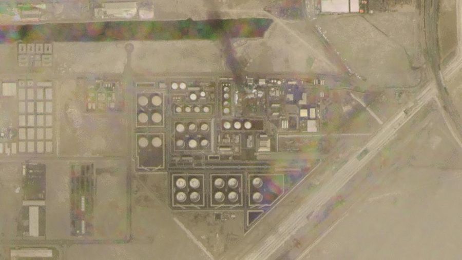 In this satellite image provided by Planet Labs PBC, white fire suppressing foam is seen after an attack on an Abu Dhabi National Oil Co. fuel depot in the Mussafah neighborhood of Abu Dhabi, United Arab Emirates, Monday, Jan. 17, 2022. A drone attack claimed by Yemen's Houthi rebels targeting a key oil facility in Abu Dhabi killed three people on Monday and sparked a fire at Abu Dhabi's international airport. (Planet Labs PBC via AP)