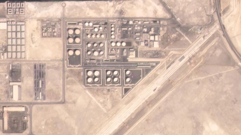 In this satellite image provided by Planet Labs PBC, white fire suppressing foam is seen after an attack on an Abu Dhabi National Oil Co. fuel depot in the Mussafah neighborhood of Abu Dhabi, United Arab Emirates, Monday, Jan. 17, 2022. A drone attack claimed by Yemen's Houthi rebels targeting a key oil facility in Abu Dhabi killed three people on Monday and sparked a fire at Abu Dhabi's international airport. (Planet Labs PBC via AP)