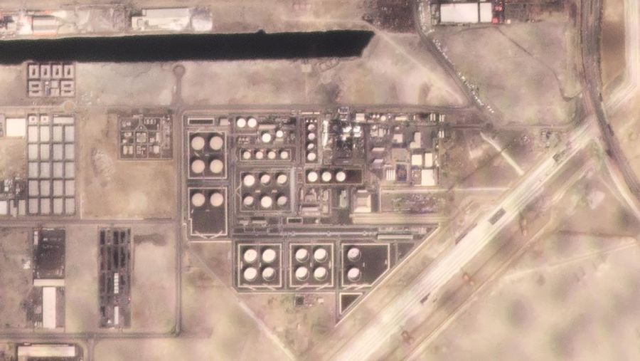 In this satellite image provided by Planet Labs PBC, white fire suppressing foam is seen after an attack on an Abu Dhabi National Oil Co. fuel depot in the Mussafah neighborhood of Abu Dhabi, United Arab Emirates, Monday, Jan. 17, 2022. A drone attack claimed by Yemen's Houthi rebels targeting a key oil facility in Abu Dhabi killed three people on Monday and sparked a fire at Abu Dhabi's international airport. (Planet Labs PBC via AP)