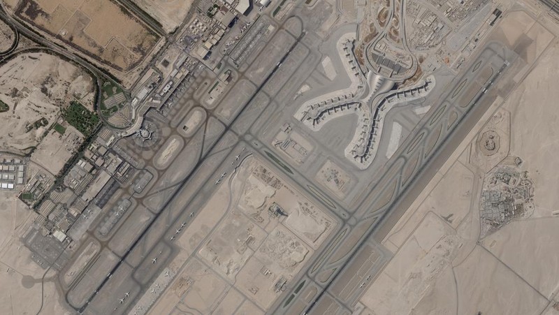 In this satellite image provided by Planet Labs PBC, white fire suppressing foam is seen after an attack on an Abu Dhabi National Oil Co. fuel depot in the Mussafah neighborhood of Abu Dhabi, United Arab Emirates, Monday, Jan. 17, 2022. A drone attack claimed by Yemen's Houthi rebels targeting a key oil facility in Abu Dhabi killed three people on Monday and sparked a fire at Abu Dhabi's international airport. (Planet Labs PBC via AP)