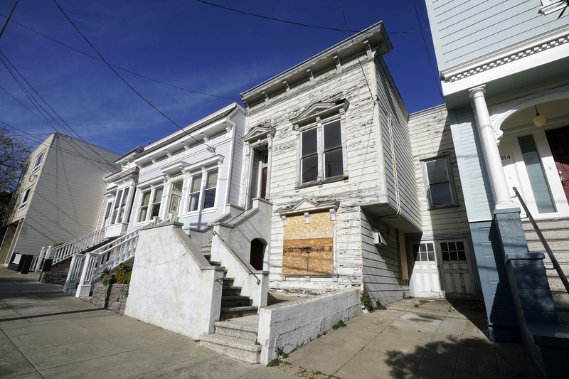San Francisco $2 Million Fixer A pedestrian walks a dog past a recently sold Victorian home in San Francisco, Friday, Jan. 14, 2022. The decaying, 122-year-old Victorian marketed as