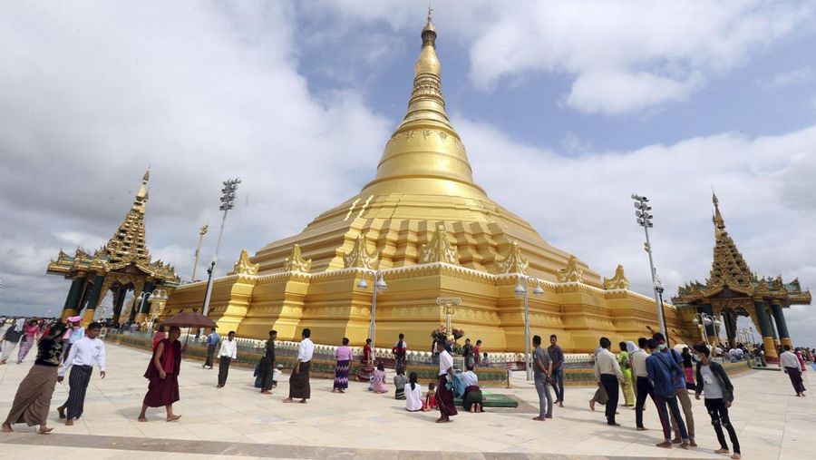 Buddhist devotees visit the Uppatasanti Pagoda as they celebrate the Full Moon day of Waso, Tuesday, July 16, 2018, in Naypyitaw, Myanmar. The Full Moon Day of Waso marks the start of the Buddhist Lent, which lasts for three full months during the rainy season. (AP Photo/Aung Shine Oo)