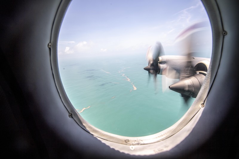A general view from a New Zealand Defence Force P-3K2 Orion surveillance flight shows heavy ash fall over Nomuka in Tonga after the Pacific island nation was hit by a tsunami triggered by an undersea volcanic eruption January 17, 2022. Picture taken January 17, 2022. New Zealand Defence Force/Handout via REUTERS ATTENTION EDITORS - THIS IMAGE WAS PROVIDED BY A THIRD PARTY. NO RESALES. NO ARCHIVE.
