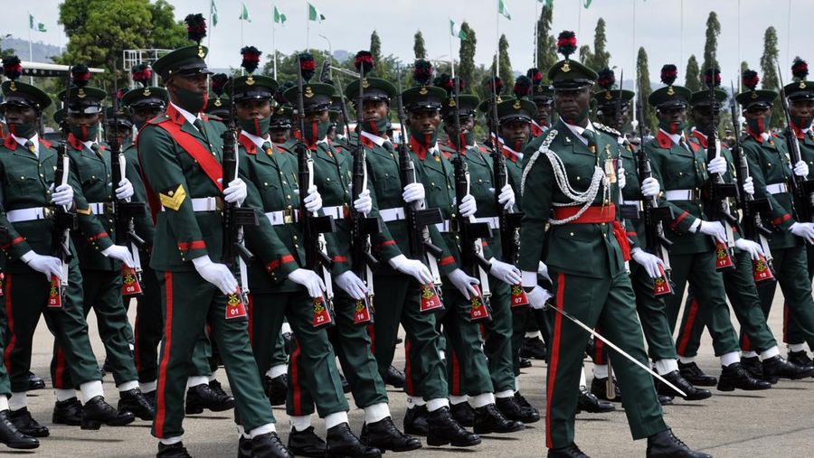 Nigerian soldiers march during celebrations for the 61st anniversary of Nigerian independence, in Abuja, Nigeria Friday, Oct. 1, 2021. Nigerian President Muhammadu Buhari says he has directed the lifting of the ban on Twitter's operations in Nigeria but only if certain conditions are met including Twitter's 