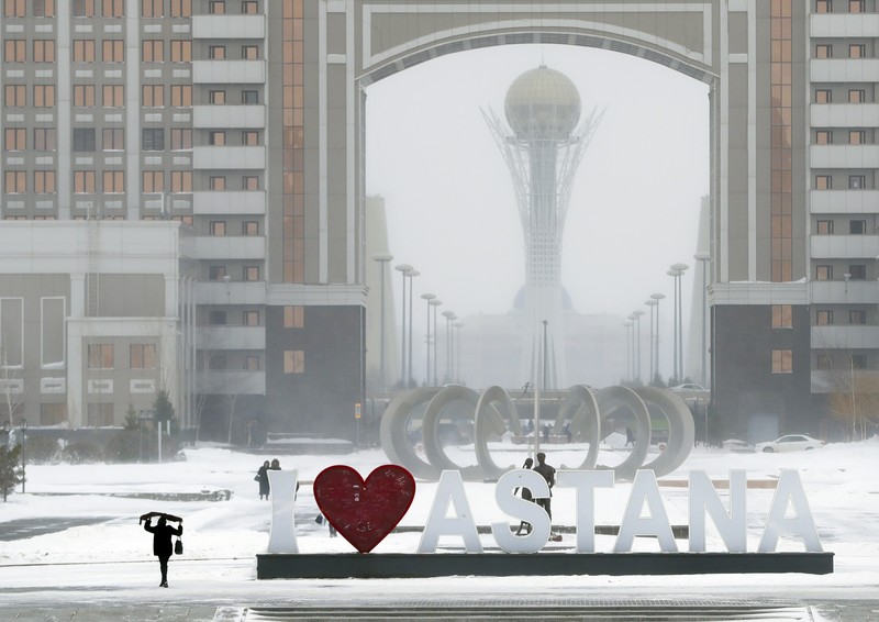 Kazakhstan Capital FILE - In this Wednesday, Jan. 25, 2017 file photo, residents walk in a street in Astana, Kazakhstan. The parliament of the Central Asian nation of Kazakhstan on Wednesday March 20, 2019, voted to rename the country's capital Nursultan, after the outgoing longtime leader. (AP Photo/Sergei Grits, File)