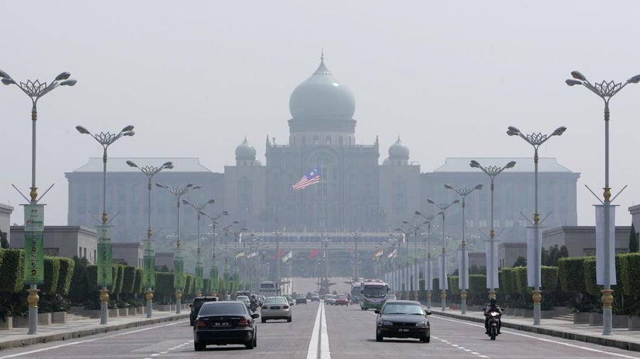 Putrajaya's landmark Prime Minister's building is seen covered by haze in Putrajaya, outside Kuala Lumpur, Malaysia, Thursday, Aug. 6, 2009. Pollution caused by fires, mainly from neighboring Indonesia, enveloped Malaysia Wednesday, Aug. 5, 2009 as air quality in the country's east and near the biggest city dropped to unhealthy. (AP Photo/Lai Seng Sin)
