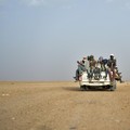 FILE - In this Monday, June 4, 2018 file photo, Nigeriens and third-country migrants head towards Libya from Agadez, Niger. Algeria’s deadly expulsions of migrants into the Sahara Desert have nearly ground to a halt after widespread condemnation an