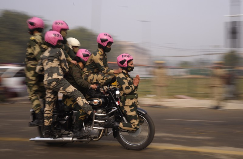 An all women team from Indian Border Security force displays their skill on a moving motorcycle during the rehearsal for the upcoming Republic Day parade at the Raisina hills, the government seat of power, in New Delhi, India, Thursday, Jan. 20, 2022. India celebrates Republic Day on Jan. 26, highlighted by a march past by different branches of the military as well as a display of arms and missiles. (AP Photo/Manish Swarup)