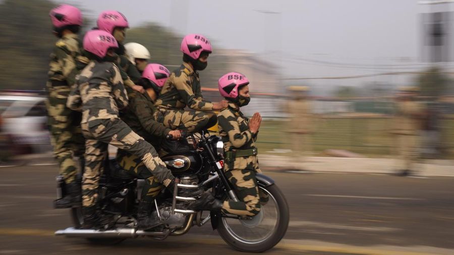 An all women team from Indian Border Security force displays their skill on a moving motorcycle during the rehearsal for the upcoming Republic Day parade at the Raisina hills, the government seat of power, in New Delhi, India, Thursday, Jan. 20, 2022. India celebrates Republic Day on Jan. 26, highlighted by a march past by different branches of the military as well as a display of arms and missiles. (AP Photo/Manish Swarup)