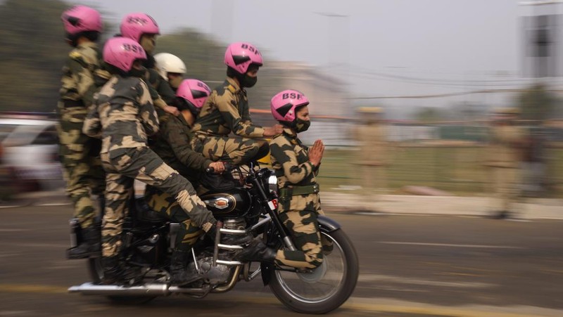 An all women team from Indian Border Security force displays their skill on a moving motorcycle during the rehearsal for the upcoming Republic Day parade at the Raisina hills, the government seat of power, in New Delhi, India, Thursday, Jan. 20, 2022. India celebrates Republic Day on Jan. 26, highlighted by a march past by different branches of the military as well as a display of arms and missiles. (AP Photo/Manish Swarup)