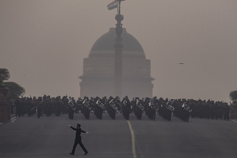 An all women team from Indian Border Security force displays their skill on a moving motorcycle during the rehearsal for the upcoming Republic Day parade at the Raisina hills, the government seat of power, in New Delhi, India, Thursday, Jan. 20, 2022. India celebrates Republic Day on Jan. 26, highlighted by a march past by different branches of the military as well as a display of arms and missiles. (AP Photo/Manish Swarup)