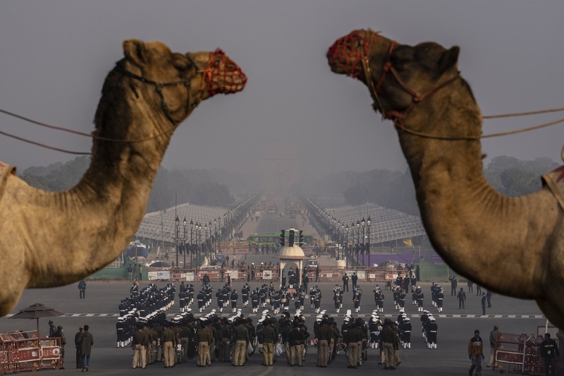 An all women team from Indian Border Security force displays their skill on a moving motorcycle during the rehearsal for the upcoming Republic Day parade at the Raisina hills, the government seat of power, in New Delhi, India, Thursday, Jan. 20, 2022. India celebrates Republic Day on Jan. 26, highlighted by a march past by different branches of the military as well as a display of arms and missiles. (AP Photo/Manish Swarup)