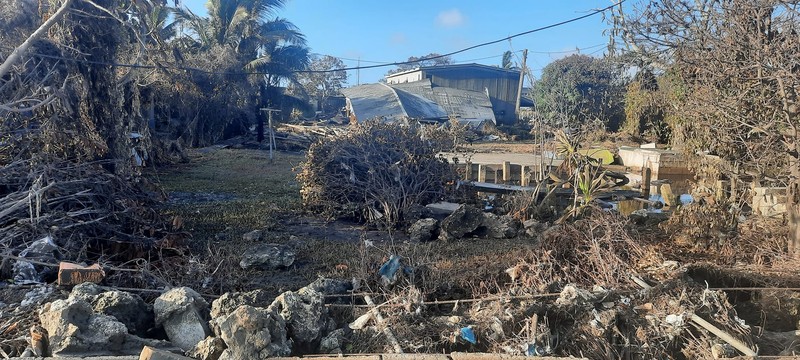 A general view shows damaged buildings following volcanic eruption and tsunami, in Tongatapu, Tonga in this picture obtained from social media on January 21, 2022. Courtesy of Marian Kupu/Broadcom Broadcasting FM87.5/via REUTERS THIS IMAGE HAS BEEN SUPPLIED BY A THIRD PARTY. MANDATORY CREDIT.