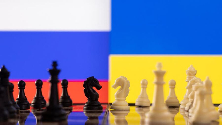 Chess pieces are seen in front of displayed Russia and Ukraine's flags in this illustration taken January 25, 2022. REUTERS/Dado Ruvic/Illustration