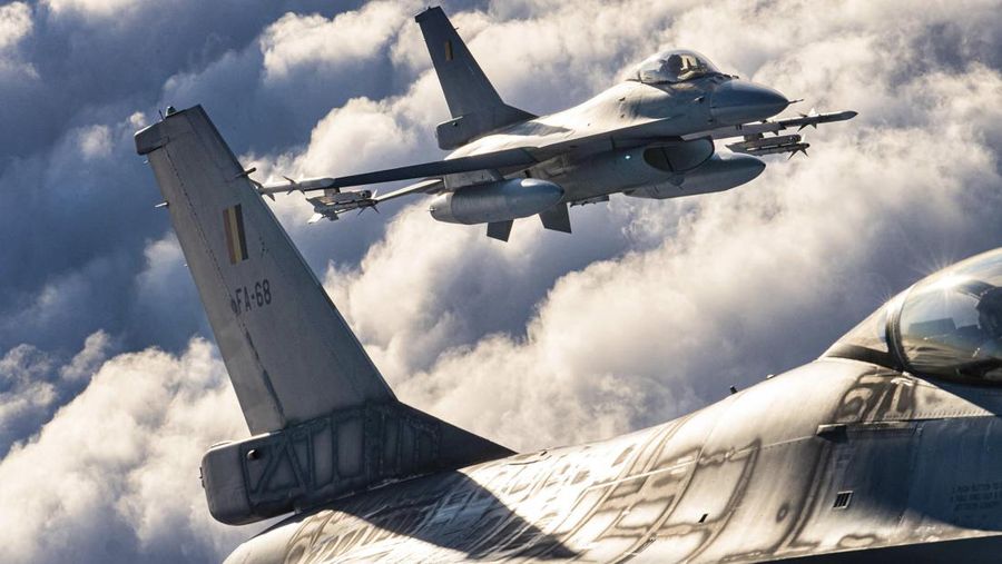 In this photo provided by Lithuanian Ministry of National Defense, Belgium Air Force F-16 fighter jet participating in NATO's Baltic Air Policing Mission, operates in Lithuanian airspace, Tuesday, Jan. 25, 2022. The NATO defence alliance on Monday said it was dispatching additional fighter jets and ships to Eastern Europe amid tensions with Russia. (Lithuanian Ministry of National Defense via AP)