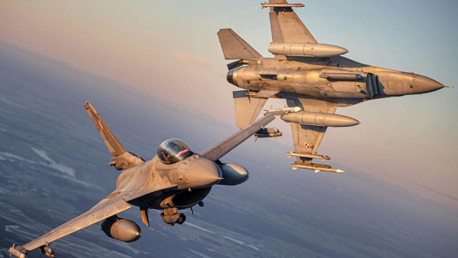 In this photo provided by Lithuanian Ministry of National Defense, Belgium Air Force F-16 fighter jet participating in NATO's Baltic Air Policing Mission, operates in Lithuanian airspace, Tuesday, Jan. 25, 2022. The NATO defence alliance on Monday said it was dispatching additional fighter jets and ships to Eastern Europe amid tensions with Russia. (Lithuanian Ministry of National Defense via AP)