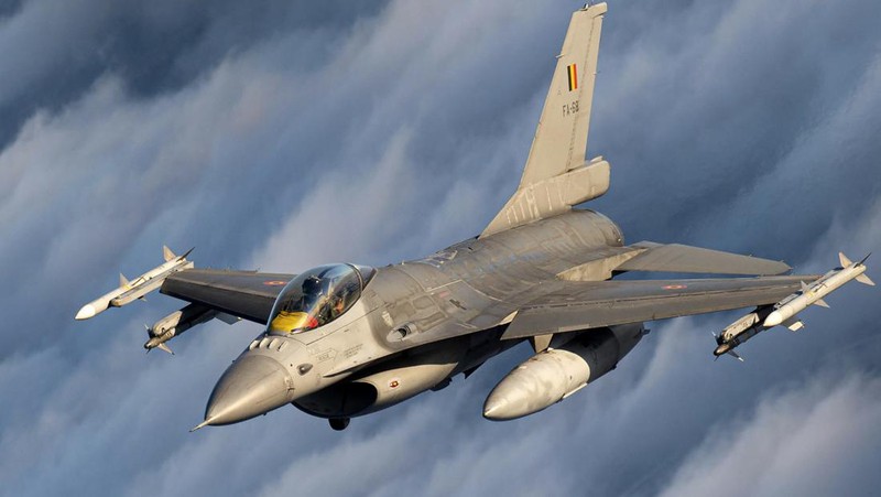 In this photo provided by Lithuanian Ministry of National Defense, Belgium Air Force F-16 fighter jet participating in NATO's Baltic Air Policing Mission, operates in Lithuanian airspace, Tuesday, Jan. 25, 2022. The NATO defence alliance on Monday said it was dispatching additional fighter jets and ships to Eastern Europe amid tensions with Russia. (Lithuanian Ministry of National Defense via AP)