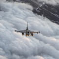 In this photo provided by Lithuanian Ministry of National Defense, Belgium Air Force F-16 fighter jet participating in NATO's Baltic Air Policing Mission operate in Lithuanian airspace, Tuesday, Jan. 25, 2022. The NATO defence alliance on Monday said