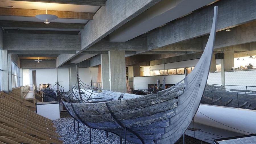 A man repairs a 10-meter wooden row boat, built in the Nordic clinker boat tradition, at the Viking Ship Museum's boatyard. Roskilde, Denmark, Monday, Jan. 17, 2022.  For thousands of years, wooden sail boats, best known for having been in use during the Viking-era, allowed the peoples of northern Europe to spread trade, influence and -- in some cases war — across the seas and rivers. In December, UNESCO, the U.N.’s culture agency, added the “clinker’ boat traditions to its list of “Intangible Cultural Heritage,” the result of the first joint nomination from the whole Nordic region. (AP Photo/James Brooks)