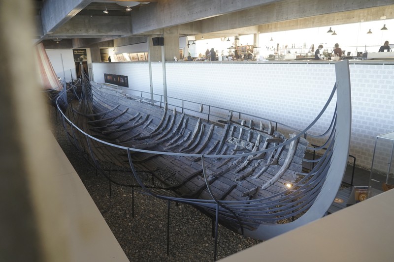 Kapal dagang Viking Denmark UNESCO A man repairs a 10-meter wooden row boat, built in the Nordic clinker boat tradition, at the Viking Ship Museum's boatyard. Roskilde, Denmark, Monday, Jan. 17, 2022. For thousands of years, wooden sail boats, best known for having been in use during the Viking-era, allowed the peoples of northern Europe to spread trade, influence and -- in some cases war — across the seas and rivers. In December, UNESCO, the U.N.’s culture agency, added the “clinker’ boat traditions to its list of “Intangible Cultural Heritage,” the result of the first joint nomination from the whole Nordic region. (AP Photo/James Brooks)
