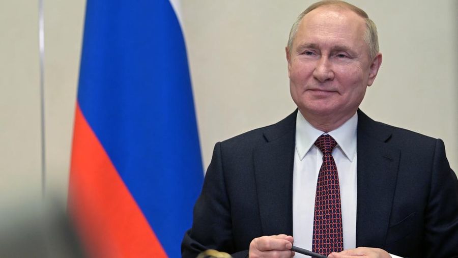 Russian President Vladimir Putin talks with members of Russia's national team ahead of the Beijing 2022 Winter Olympics, via a videoconference at the Novo-Ogaryovo residence outside Moscow, Russia, Tuesday, Jan. 25, 2022. (Alexei Nikolsky, Sputnik, Kremlin Pool Photo via AP)