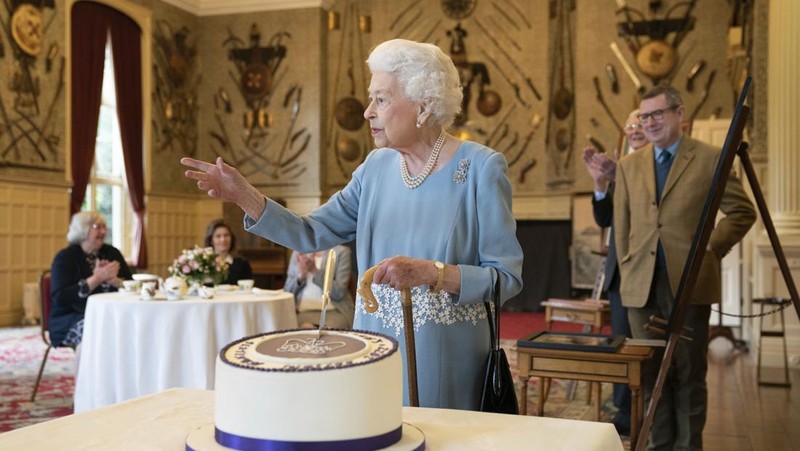 Britain's Queen Elizabeth II looks at a display of memorabilia from her Golden and Platinum Jubilees in the Oak Room at Windsor Castle, Windsor, England, in this undated but recent image that was released on Friday Feb. 4, 2022. Queen Elizabeth II will mark 70 years on the throne Sunday Feb. 6, an unprecedented reign that has made her a symbol of stability as the United Kingdom navigated an age of uncertainty. (Steve Parsons/Pool via AP)