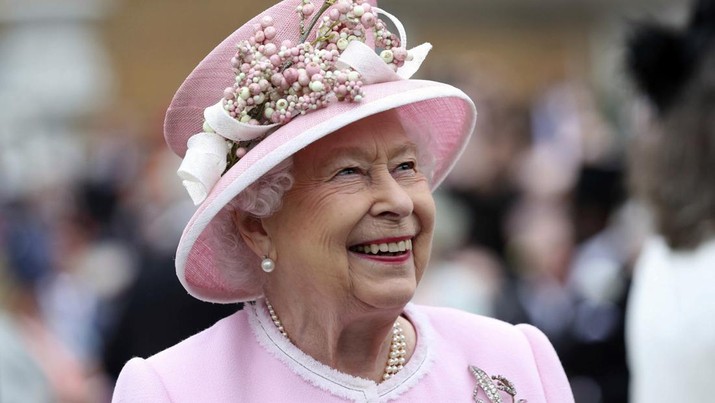FILE - Britain's Queen Elizabeth arrives for a Royal Garden Party at Buckingham Palace in London, Wednesday, May 29, 2019. Queen Elizabeth II will mark 70 years on the throne Sunday, Feb. 6, 2022, an unprecedented reign that has made her a symbol of stability as the United Kingdom navigated an age of uncertainty.  (Yui Mok/Pool Photo via AP, File)