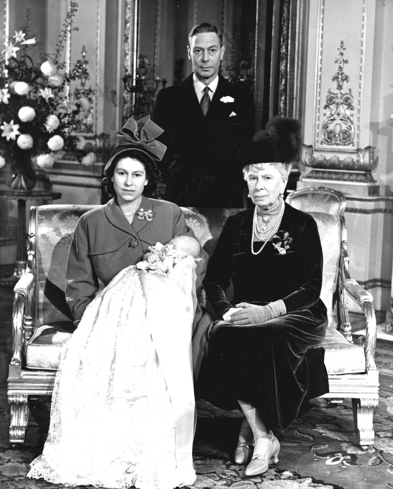CORRECTION Britain Queen Platinum Jubilee Britain's Queen Elizabeth II looks at a display of memorabilia from her Golden and Platinum Jubilees in the Oak Room at Windsor Castle, Windsor, England, in this undated but recent image that was released on Friday Feb. 4, 2022. Queen Elizabeth II will mark 70 years on the throne Sunday Feb. 6, an unprecedented reign that has made her a symbol of stability as the United Kingdom navigated an age of uncertainty. (Steve Parsons/Pool via AP)