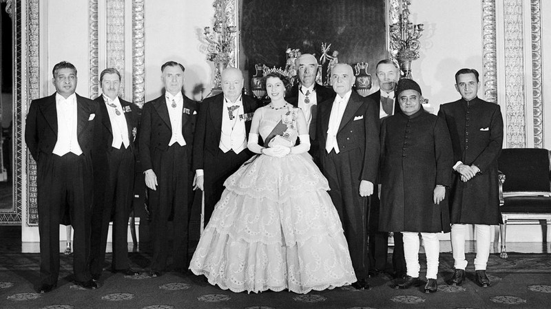Britain's Queen Elizabeth II looks at a display of memorabilia from her Golden and Platinum Jubilees in the Oak Room at Windsor Castle, Windsor, England, in this undated but recent image that was released on Friday Feb. 4, 2022. Queen Elizabeth II will mark 70 years on the throne Sunday Feb. 6, an unprecedented reign that has made her a symbol of stability as the United Kingdom navigated an age of uncertainty. (Steve Parsons/Pool via AP)