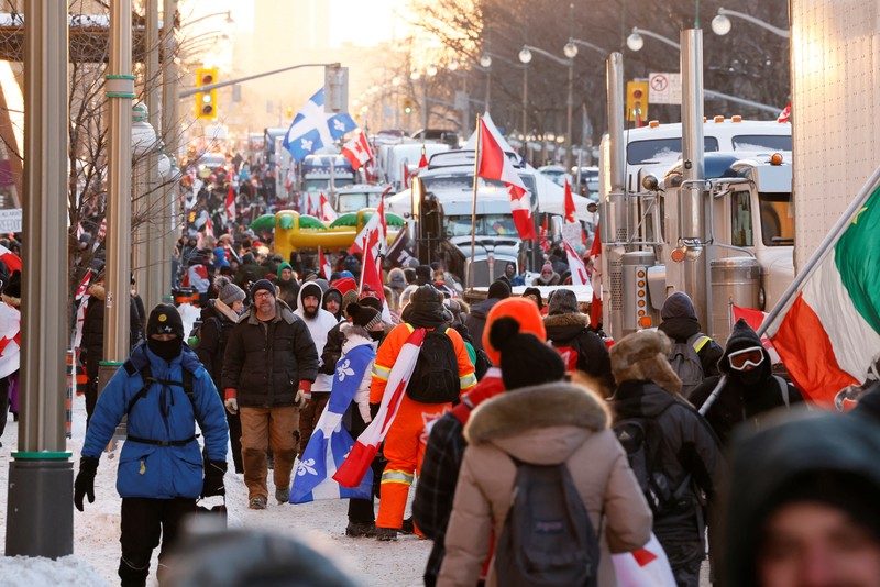 HEALTH-CORONAVIRUS/CANADA-TRUCKING Demonstrators have a dance party in the street outside the Rideau Centre as truckers and supporters continue to protest coronavirus disease (COVID-19) vaccine mandates, in Ottawa, Ontario, Canada, February 5, 2022. REUTERS/Blair Gable