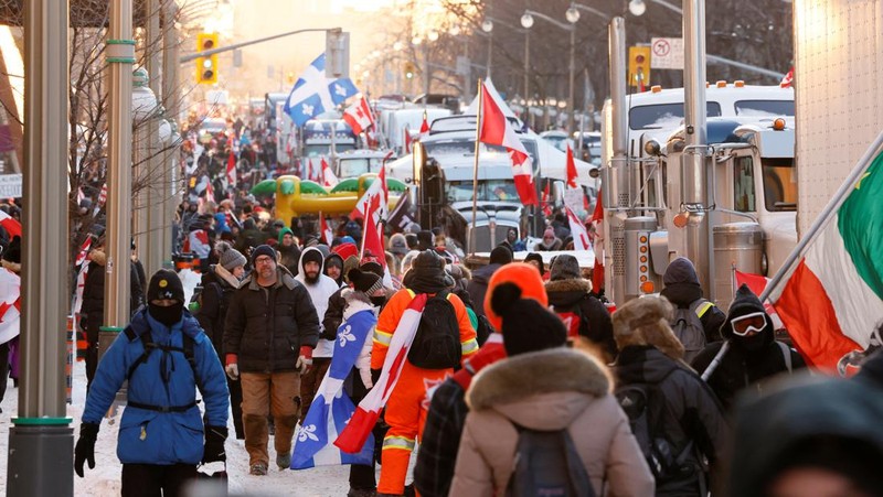 Demonstrators have a dance party in the street outside the Rideau Centre as truckers and supporters continue to protest coronavirus disease (COVID-19) vaccine mandates, in Ottawa, Ontario, Canada, February 5, 2022. REUTERS/Blair Gable