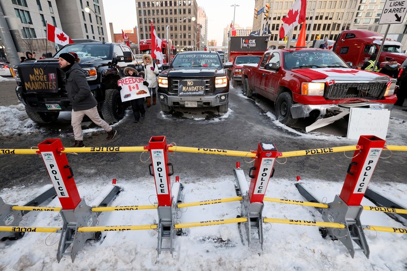 Demonstrators have a dance party in the street outside the Rideau Centre as truckers and supporters continue to protest coronavirus disease (COVID-19) vaccine mandates, in Ottawa, Ontario, Canada, February 5, 2022. REUTERS/Blair Gable