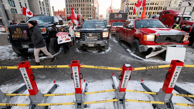 Demonstrators have a dance party in the street outside the Rideau Centre as truckers and supporters continue to protest coronavirus disease (COVID-19) vaccine mandates, in Ottawa, Ontario, Canada, February 5, 2022. REUTERS/Blair Gable
